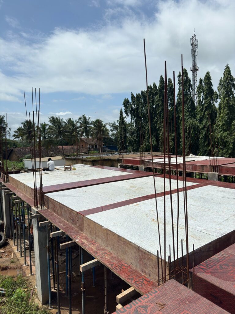 PAC boards and plywood being tested for formwork deflection limits under heavy loads on a construction site